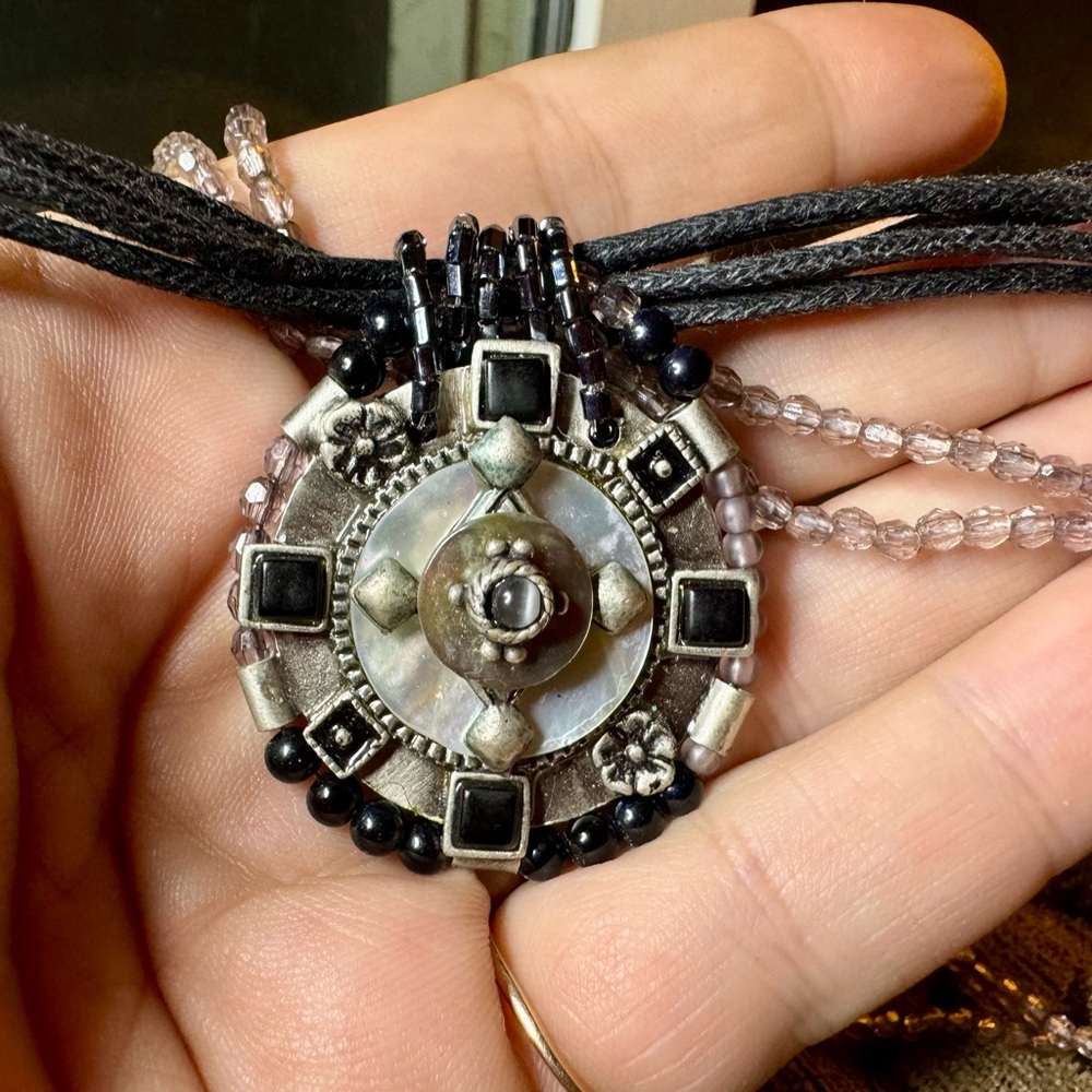 Bead and cord necklace with extender.